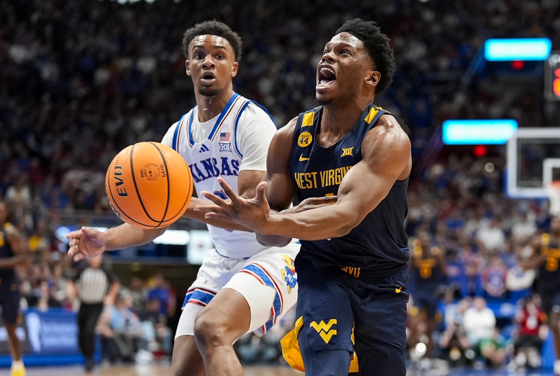 West Virginia kehilangan keunggulan besar tetapi pulih untuk mengalahkan Kansas No.7 West Virginia kehilangan keunggulan besar tetapi pulih untuk mengalahkan Kansas No.7